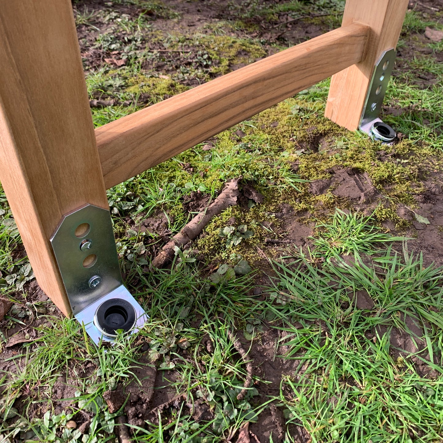 Memorial bench installed with soft ground anchors